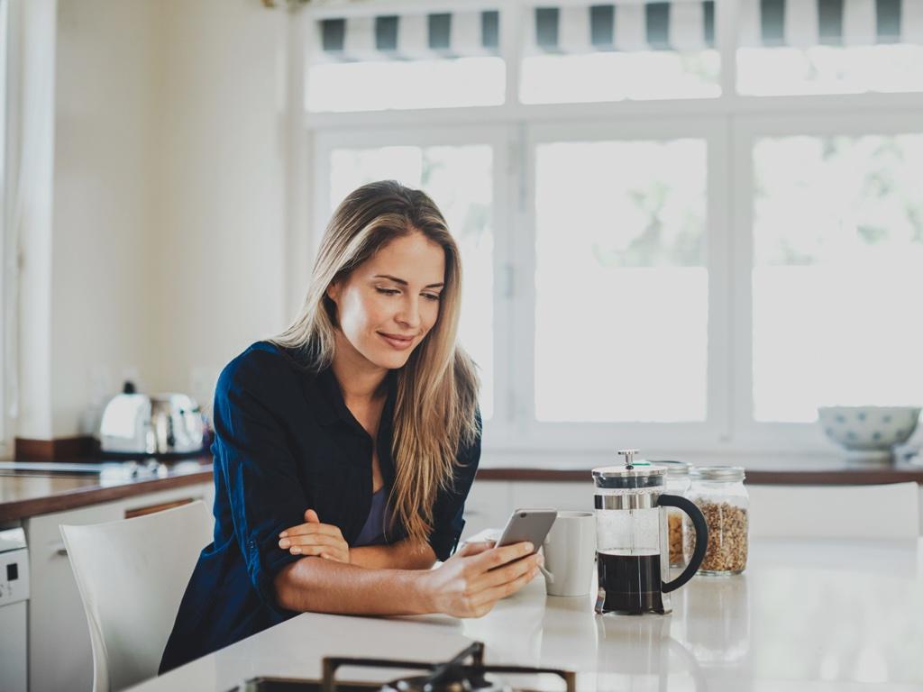 Woman20with20phone20and20coffee 1